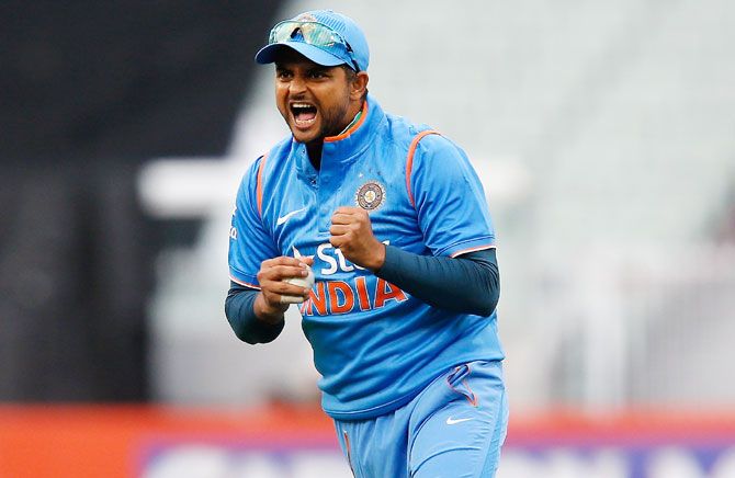 Suresh Raina of India reacts after taking a catch