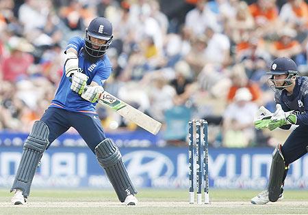 England batsman Moeen Ali plays a cut shot watched by Scotland's Matt Cross (right) during their World Cup match in Christchurch on Monday