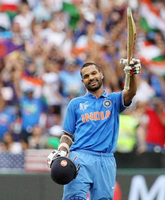 India's Shikhar Dhawan celebrates after scoring a century