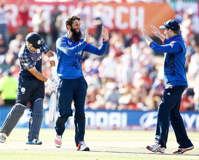 Moeen Ali of England celebrates with team mates