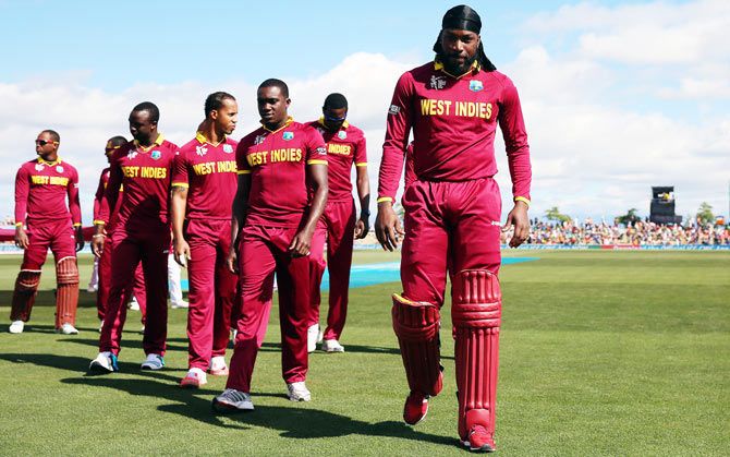 Chris Gayle (right) with his West Indies teammates