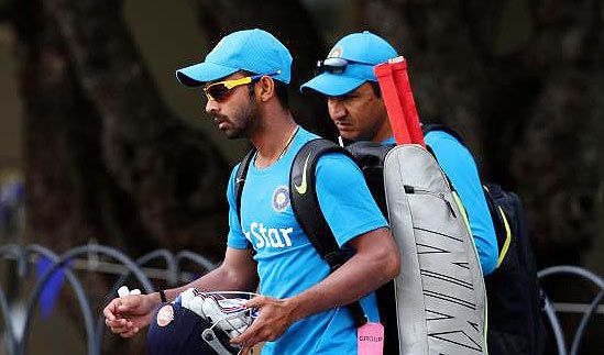 Indian player Ajinkya Rahane and Indian assistant coach Sanjay Bangar during a practice session