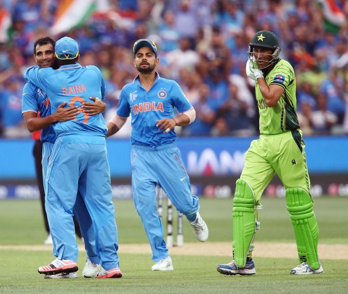 Pakistan's Younis Khan walks back to the pavillion after being dismissed