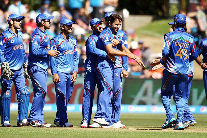 Afghanistan team mates celebrate a Scotland wicket during their 2015 ICC Cricket World Cup match at University Oval in Dunedin on Thursday