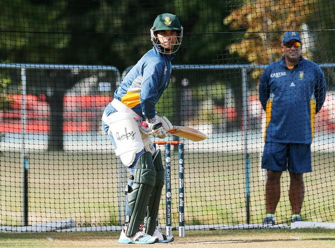 JP Duminy of South Africa bats while watched by coach Russell Domingo during a nets session
