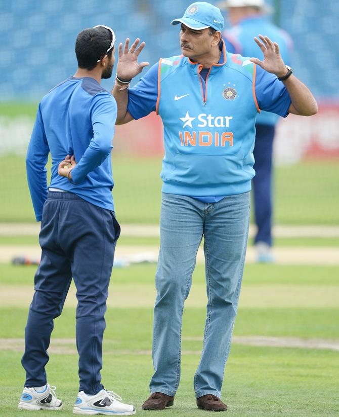 Ravi Shastri speaks with Ravindra Jadeja during a nets session