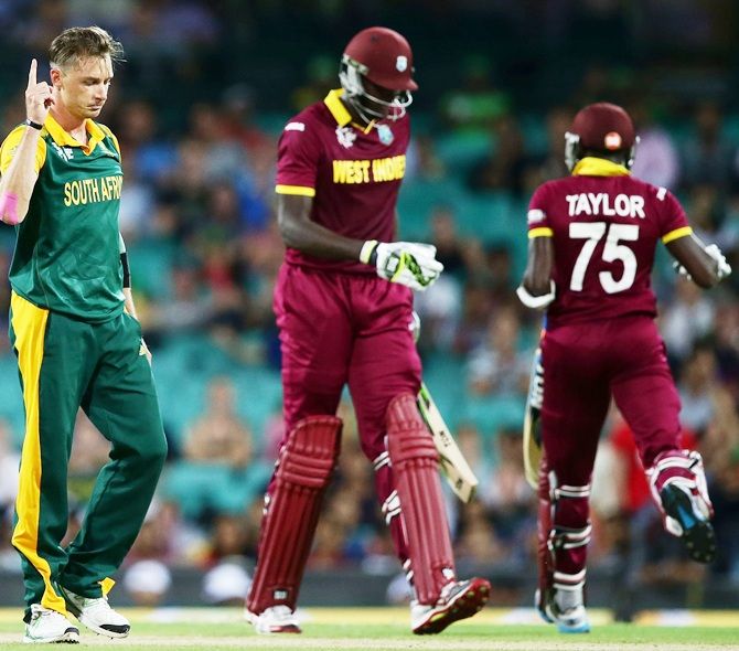 Dale Steyn of South Africa celebrates taking the wicket of Jason Holder of West Indies