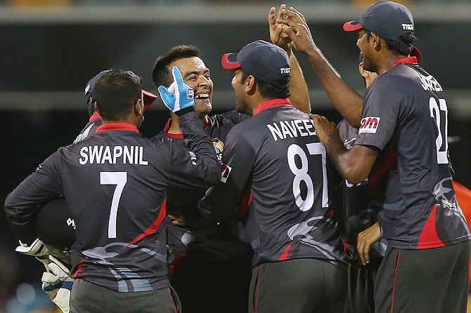 United Arab Emirates captain Mohamed Tauqir celebrates with teammates