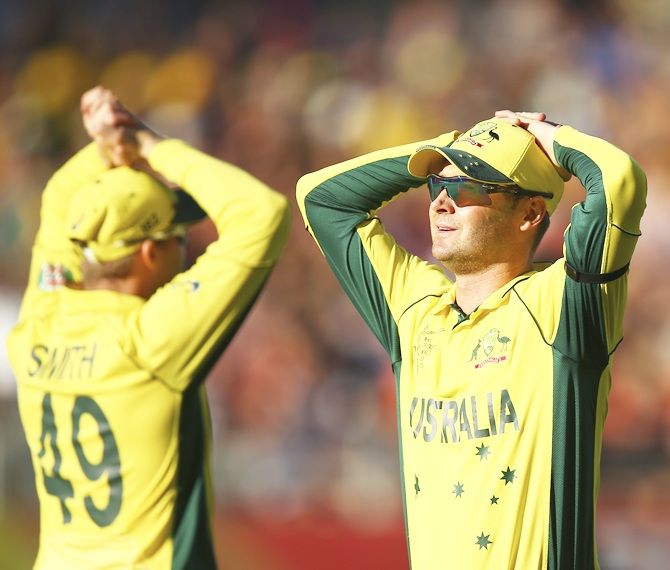 Michael Clarke, right, and Steven Smith of Australia look