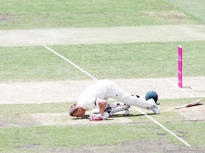 David Warner of Australia kisses the ground