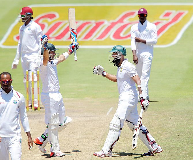 Dean Elgar and Hashim Amla of South Africa celebrate their win on Day 5 of the 3rd Test against West Indies at Sahara Park Newlands in Cape Town on Tuesday
