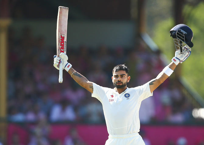 Virat Kohli of India celebrates scoring a century against Australia on Day 3 of the fourth Test at Sydney Cricket Ground on Thursday