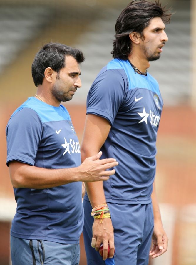 Mohammed Shami and Ishant Sharma look on during a training session