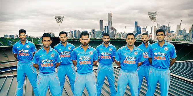 Umesh Yadav, Ajinkya Rahane, Rohit Sharma, Virat Kohli, Ravindra Jadeja, captain Mahendra Singh Dhoni, Shikhar Dhawan and R Ashwin pose with their new kits at in Melbourne on Thursday