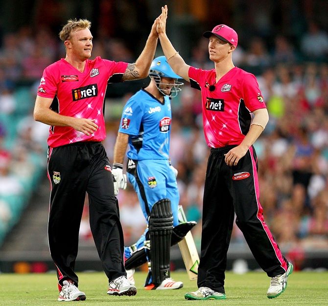 Doug Bollinger of the Sixers celebrates after taking a wicket of Tim Ludeman of the Strikers during the   Big Bash League match 