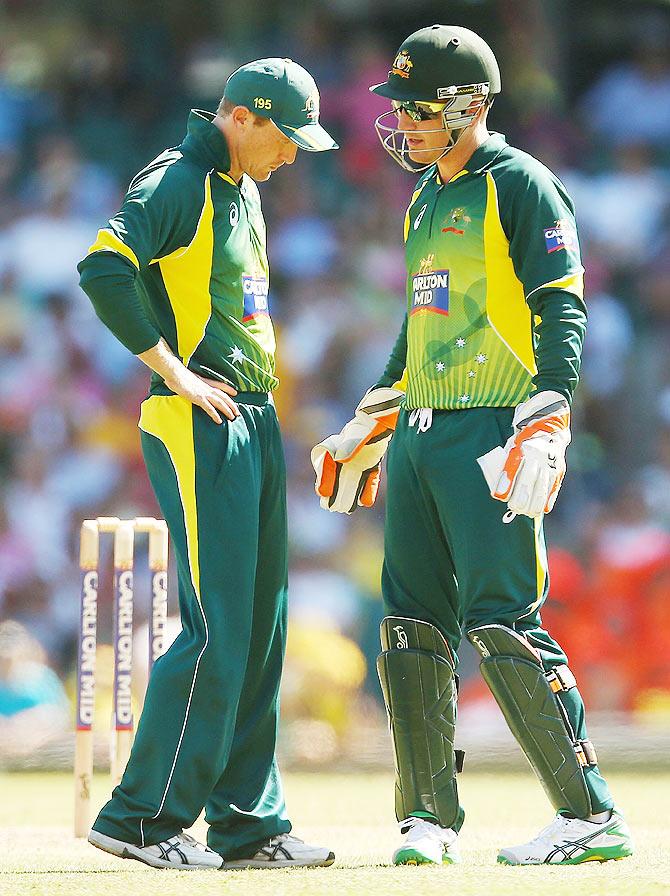 Australia's George Bailey and teammate Brad Haddin chat