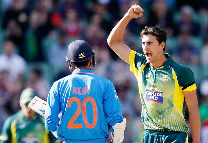 Mitchell Starc of Australia celebrates after dismissing Axar Patel of India