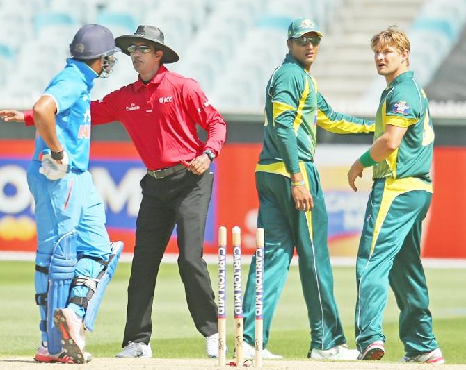 Shane Watson of Australia and Rohit Sharma of India exchange words