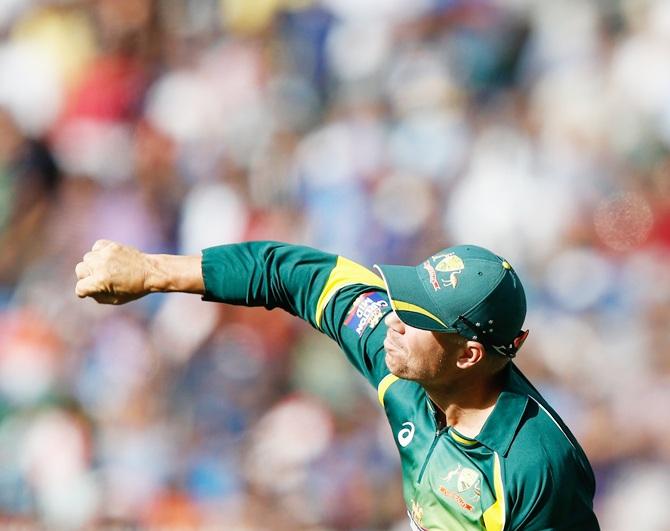 David Warner of Australia throws the ball during the One Day International match between Australia and   India at Melbourne Cricket Ground