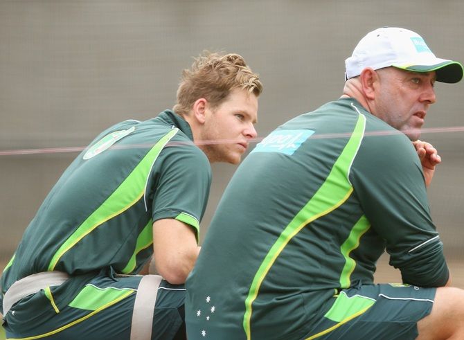 Steven Smith and Darren Lehmann the coach of Australia look on