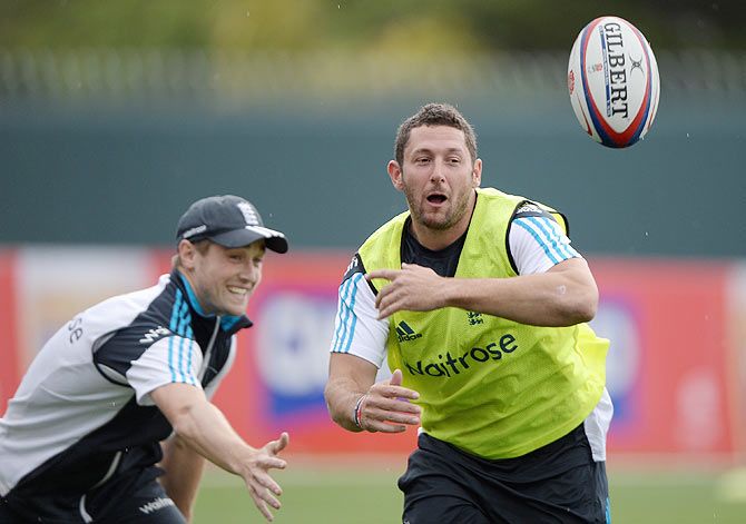 Tim Bresnan of England plays touch rugby with Chris Woakes during a nets session at Bellerive Oval in Hobart on Thursday