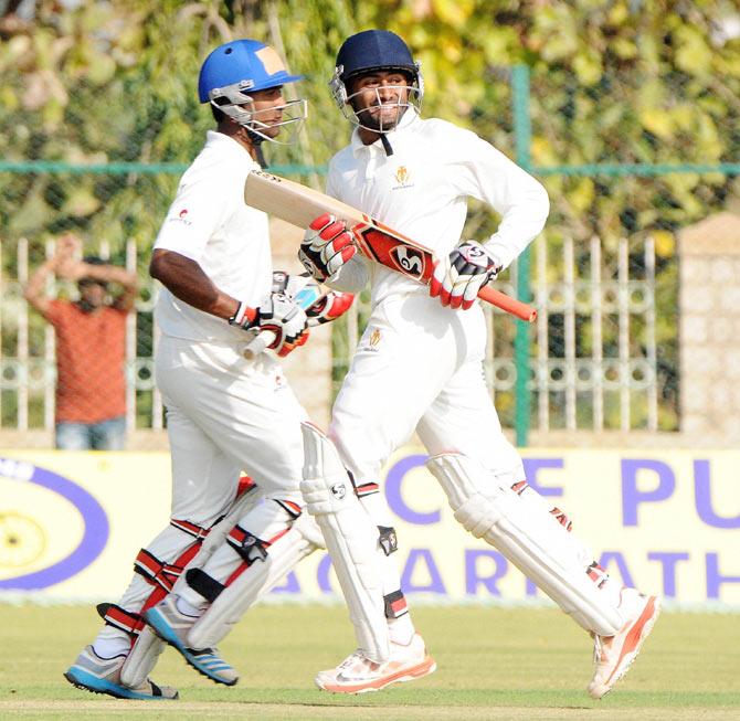 Karnataka batsmen running between the wicket during their Ranji match against Baroda in Mysore on Saturday