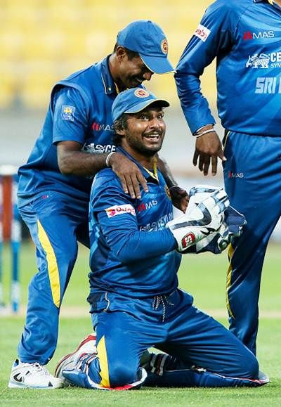 Sri Lanka’s Kumar Sangakkara is congratulated by teammate Nuwan Kulasekera after taking a catch to dismiss Corey Anderson of New Zealand during the One Day International at Westpac Stadium on January 29, 2015 in Wellington.