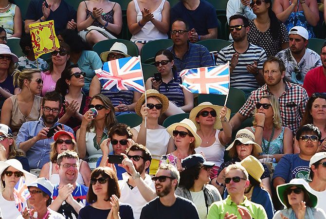 Supporters of Great Britain'S Andy Murray watch him play in his first round match against Kazakhstan's Mikhail Kukushkin on Tuesday. Photograph: Shaun Botterill/Getty Images