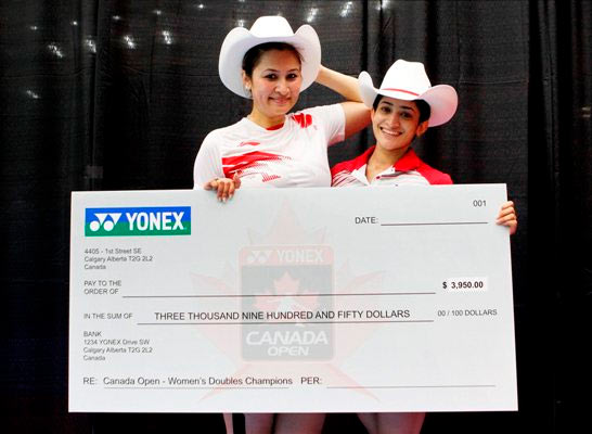 India's Jwala Gutta and Ashwini Ponnappa pose after winning the Canada Open women's doubles title in Calgary