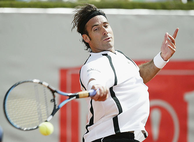 Spain'S Alex Corretja plays a forehand