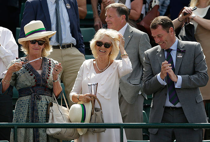 The Duchess of Cornwall, Camilla Parker (centre) smiles after Andy Murray's match