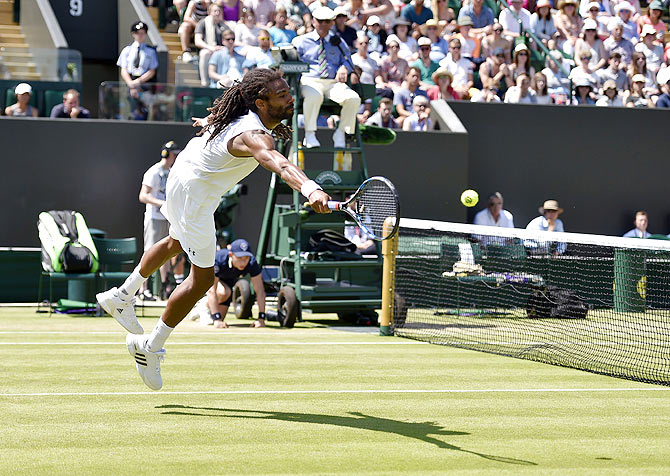 Dustin Brown plays a return against Viktor Troicki