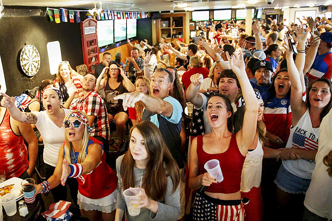 US fans react as they watch the Women's World Cup final match between USA and Japan, at the Underground Pub and Grill in Hermosa Beach, California on Sunday