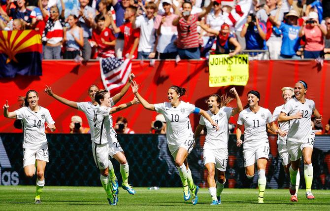 USA's Carli Lloyd #10 celebrates with teammates after scoring her second goal in the FIFA Women's World Cup final against Japan at BC Place Stadium