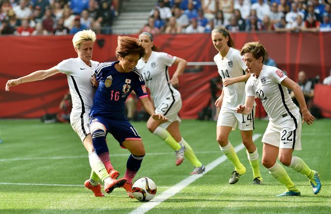 Japan's Mana Iwabuchi #16 is challenged by USA's Abby Wimbach in the second half