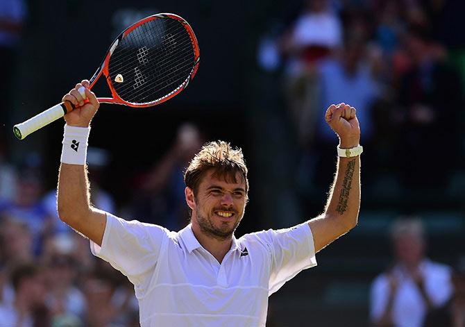 Stanislas Wawrinka celebrates victory against David Goffin