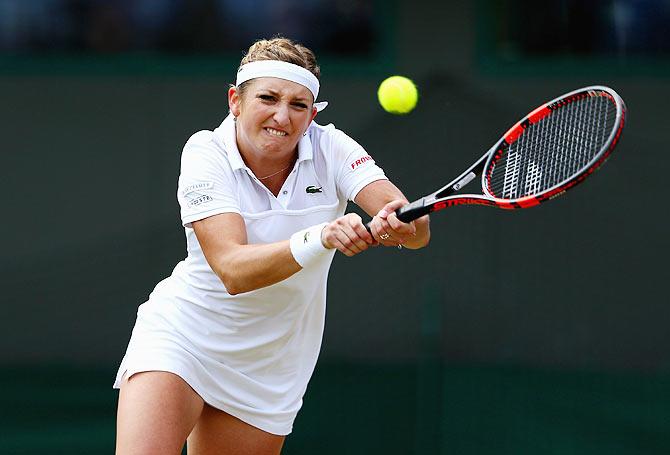 Switzerland's Timea Bacsinszky plays a backhand return