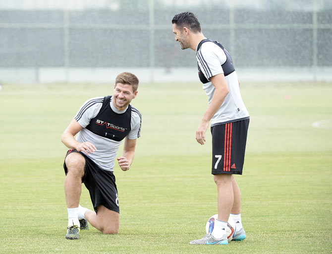 New Los Angeles Galaxy midfielder Steven Gerrard (left) and teammate Robbie Keane during a training session at StubHub Center in Carson, California on Tuesday