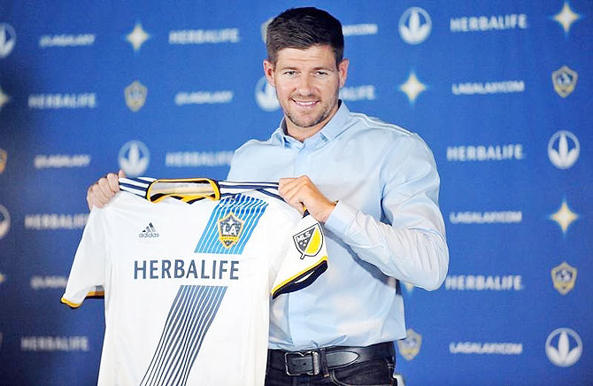 Los Angeles Galaxy midfielder Steven Gerrard poses for photos following his introduction to media at Stubhub Center in Carson, California
