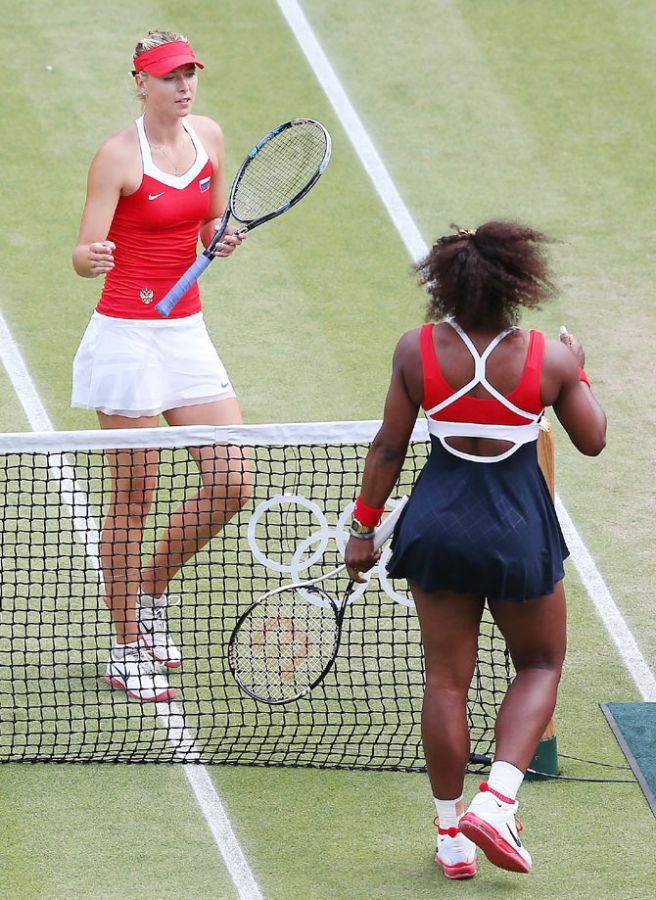 Serena Williams greets Maria Sharapova after their London Olympic Women's Singles Tennis gold medal match at Wimbledon on August 4, 2012