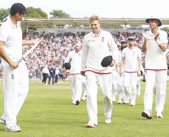 From left, England's Alastair Cook, Joe Root and Stuart Broad