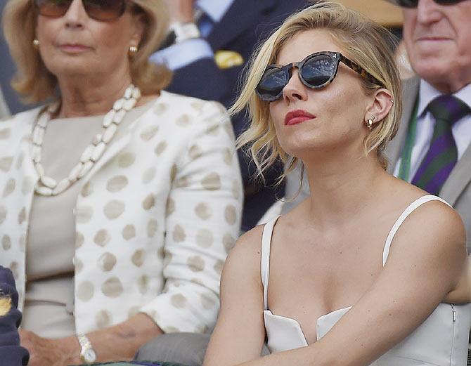 Hollywood actor Sienna Miller on Centre Court watches the Wimbledon semi-final in London on July 10