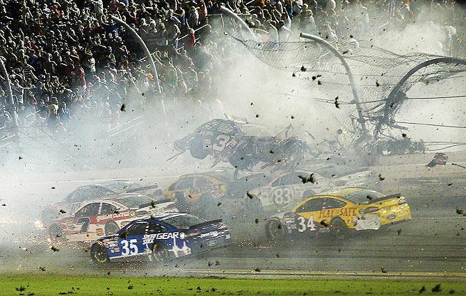 NASCAR Sprint Cup Series driver Austin Dillon car (3) crashes against the catch fence during the finish of the Coke Zero 400 at Daytona International Speedway