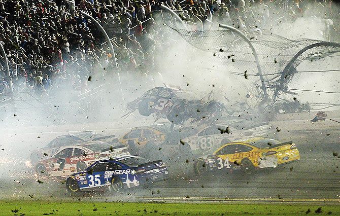 NASCAR Sprint Cup Series driver Austin Dillon car (3) crashes against the catch fence during the finish of the Coke Zero 400 at Daytona International Speedway