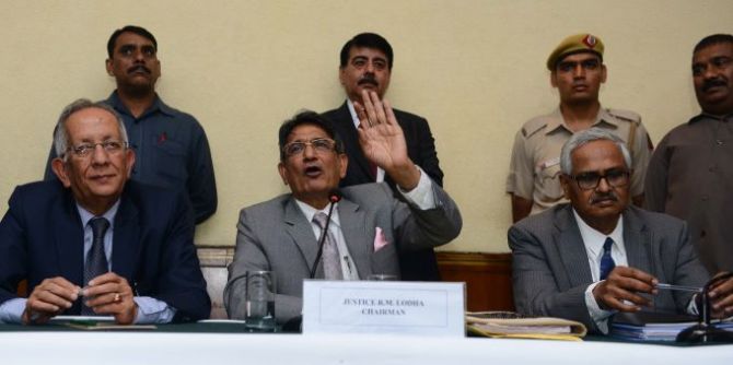 Justice Rajendra Mal Lodha, centre, speaks during a press conference in New Delhi