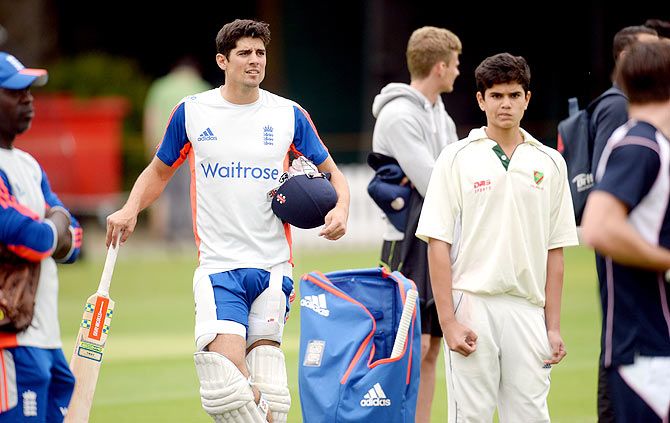 Arjun Tendulkar (right) and England's Alastair Cook look on during a nets session at the Lord's cricket ground on Wednesday