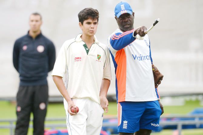 Arjun Tendulkar gets pointers from with England bowling coach Ottis Gibson
