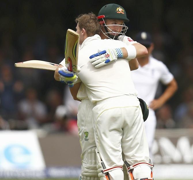 Steve Smith of Australia is congratulated by Peter Nevill