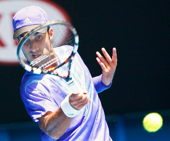 India's Yuki Bhambri hits a return to Andy Murray of Britain during their men's singles first round match at the Australian Open. Photograph: Athit Perawongmetha/Reuters