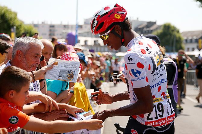 Daniel Teklehaimanot of Eritrea and MTN-Qhubeka signs autographs for fans before Stage 10 of the Tour de France, a 167 km stage between Tarbes and La Pierre-Saint-Martin, in Tarbes, France, on July 14